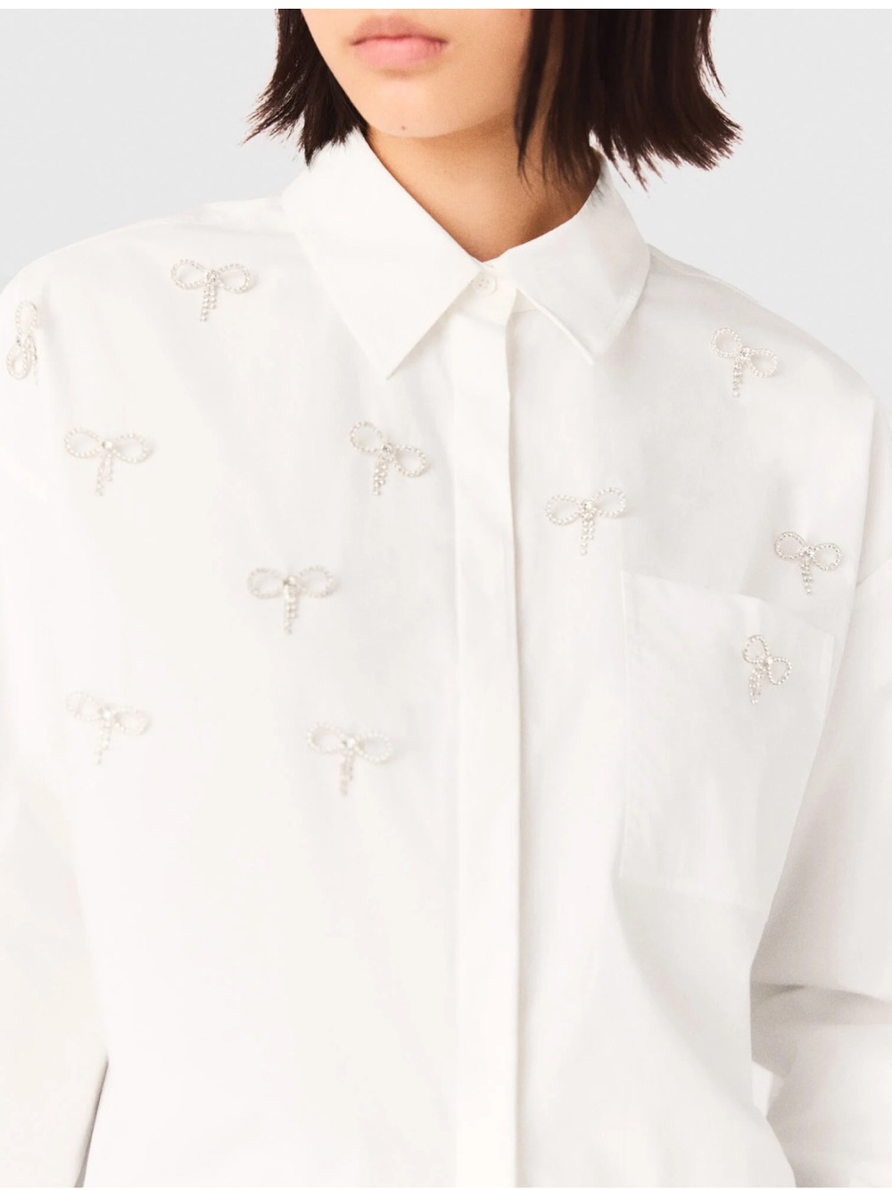 MAJE White Embellished Bow Button-Down Shirt with crystal bow embellishments.